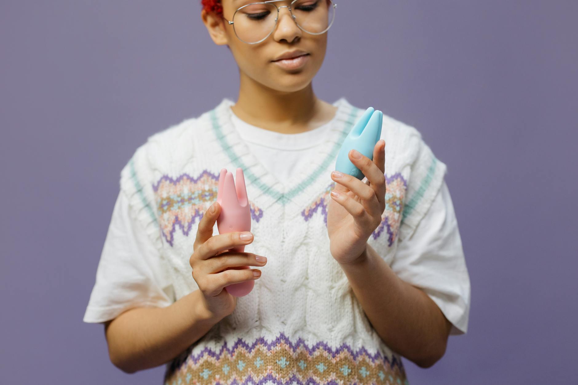 Woman holding lemon vibrators, exploring pleasure and sensuality over 40